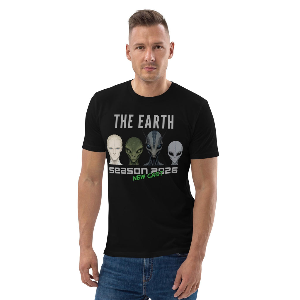 The Earth Season 2026 alien T-shirt in black, worn by a model with hands in pockets, front view.
