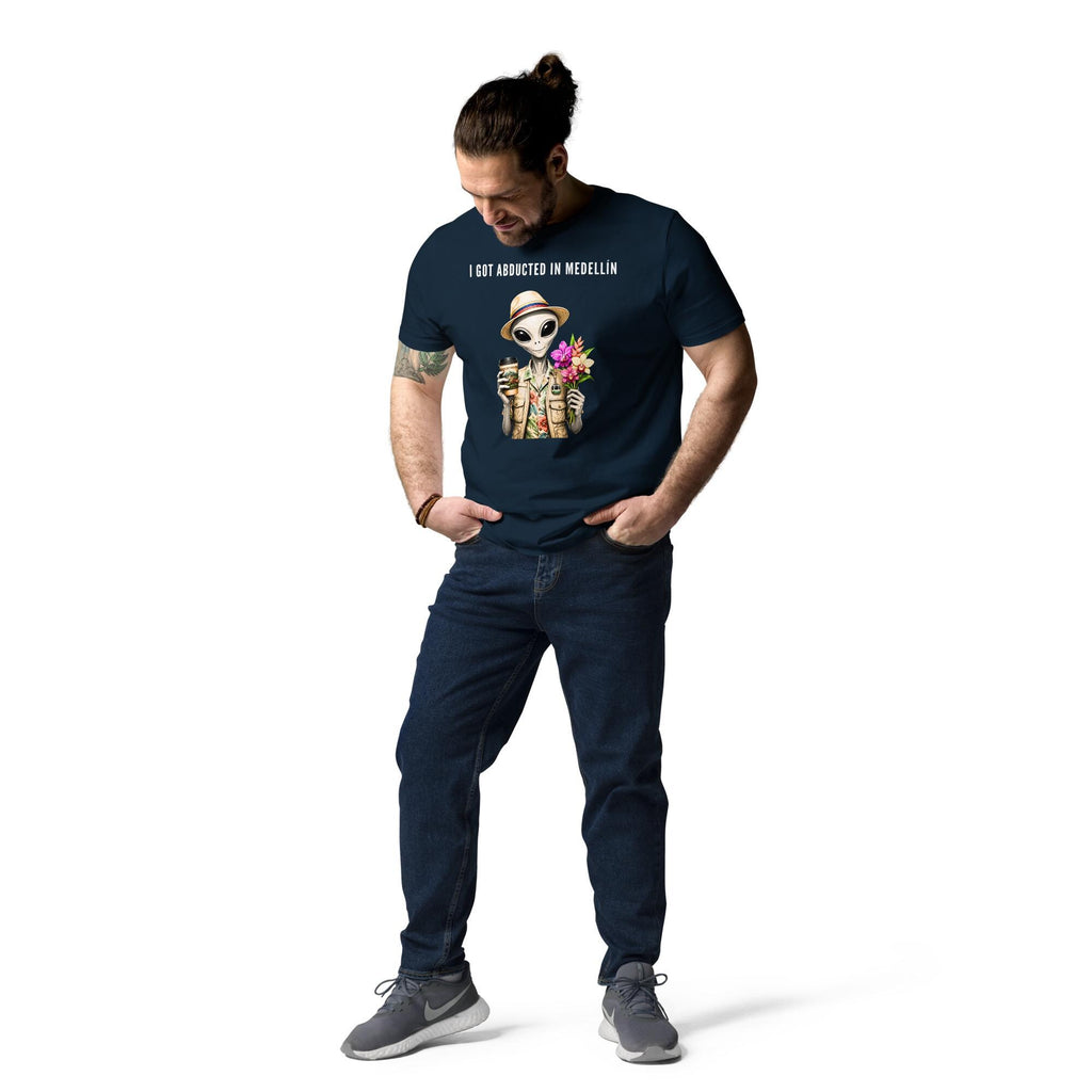 I Got Abducted in Medellin alien T-shirt in navy, full-length view on a model looking down at the graphic.