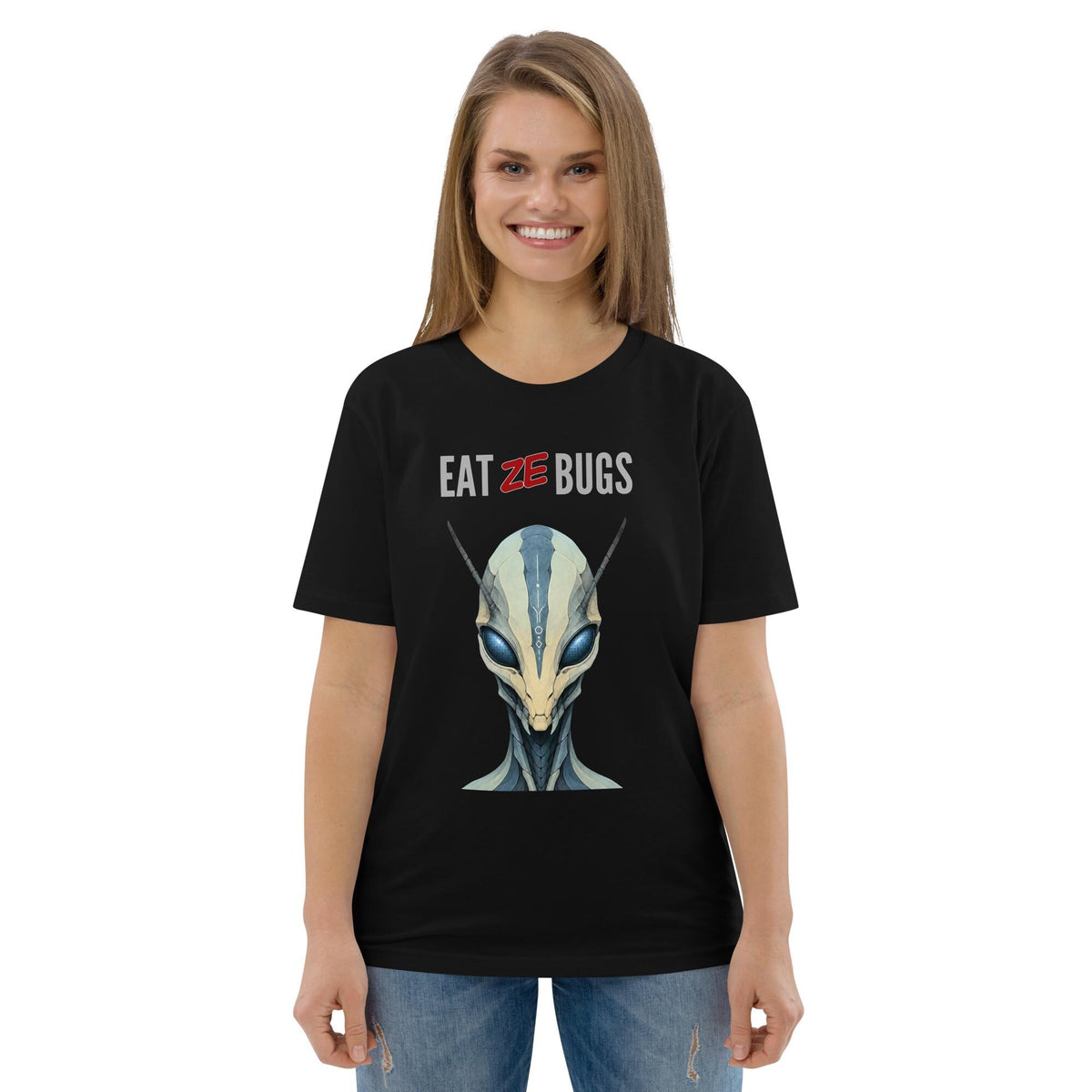 Eat Ze Bugs alien T-shirt in black, worn by a smiling model with blue jeans.