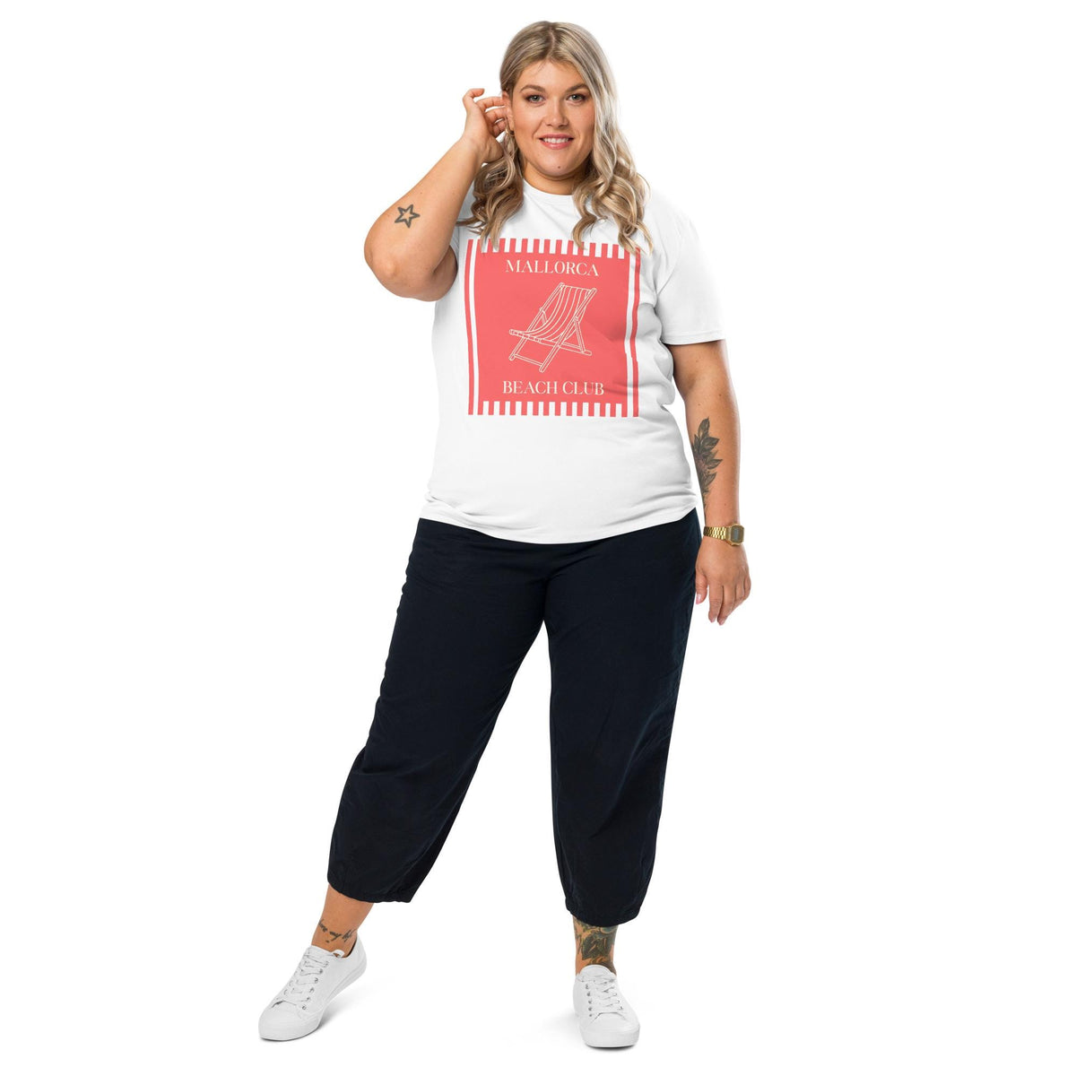 Mallorca Beach Club T-shirt in white, full-length view on a model with black trousers.