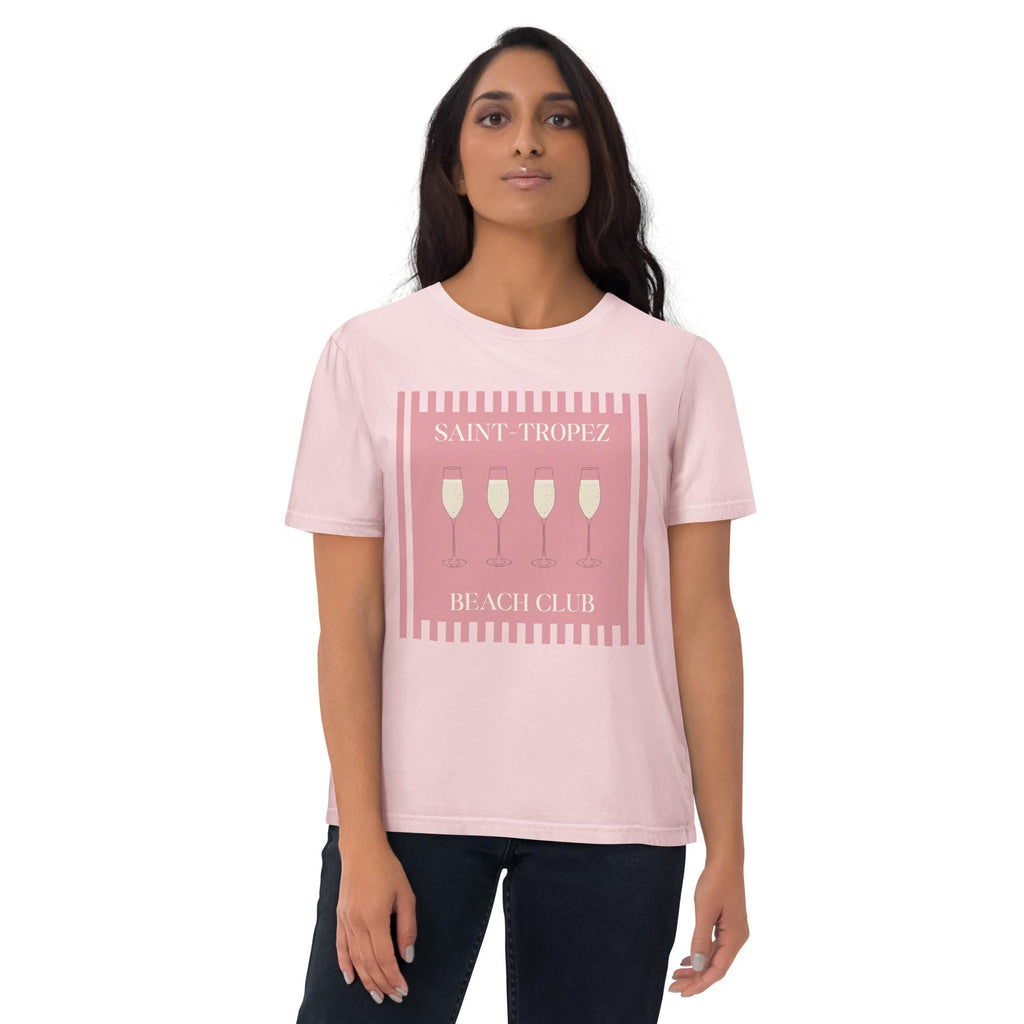 Saint-Tropez Beach Club T-shirt in pink, worn by a model with dark trousers, front view.