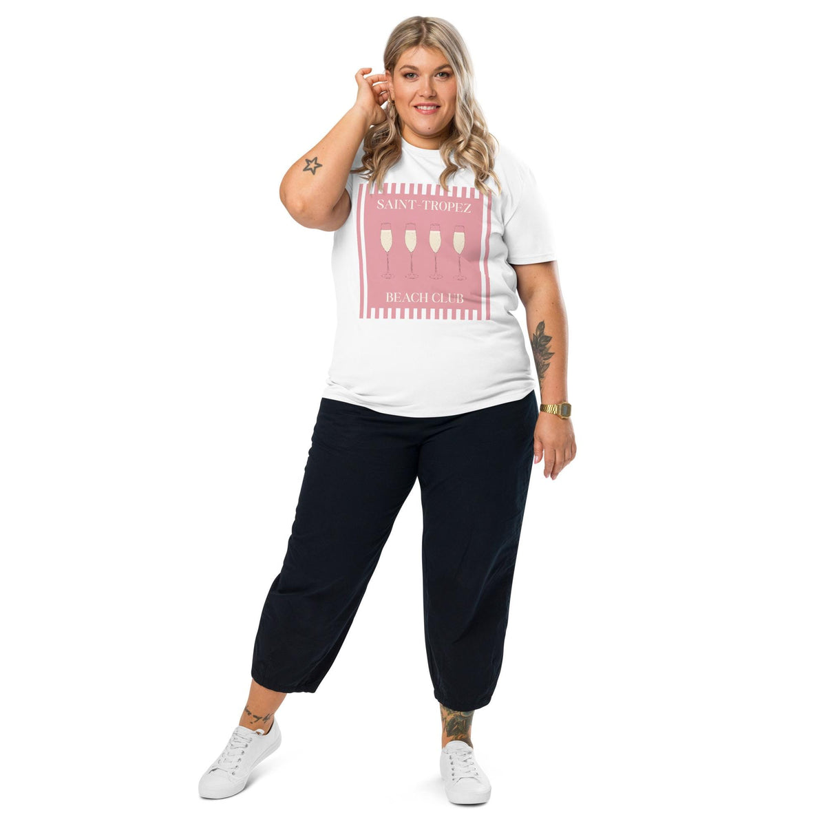 Saint-Tropez Beach Club T-shirt in white, full-length view on a model with black trousers.
