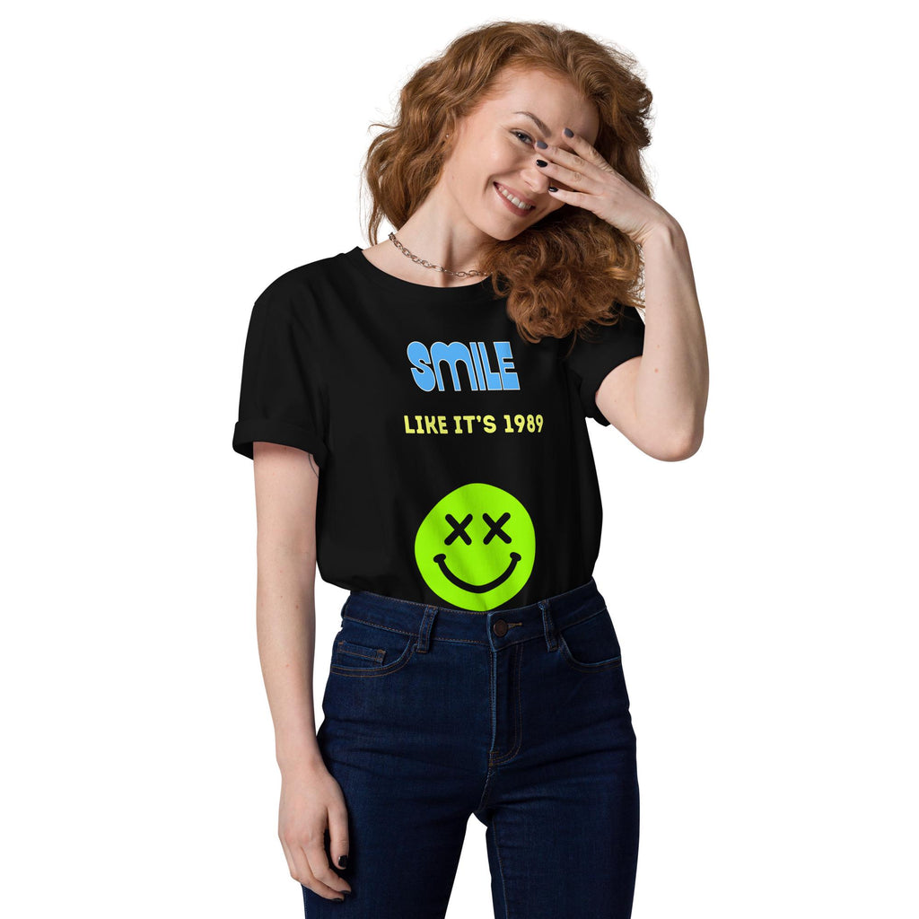 Smile Like It's 1989 rave T-shirt in black, worn by a model with one hand raised to the face.