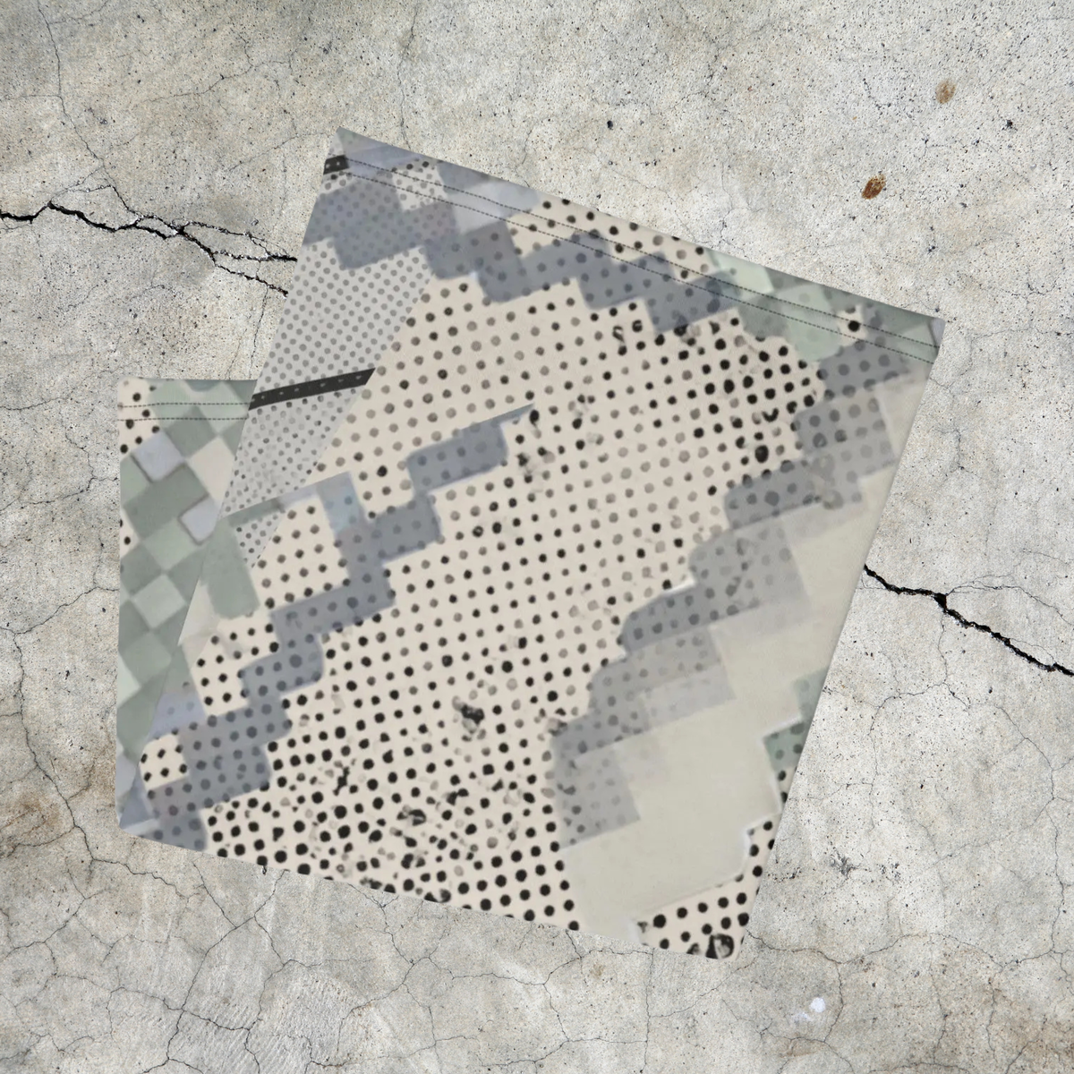 Urban Concrete 9 neck gaiter folded to show light grey blocks and dense black dots.