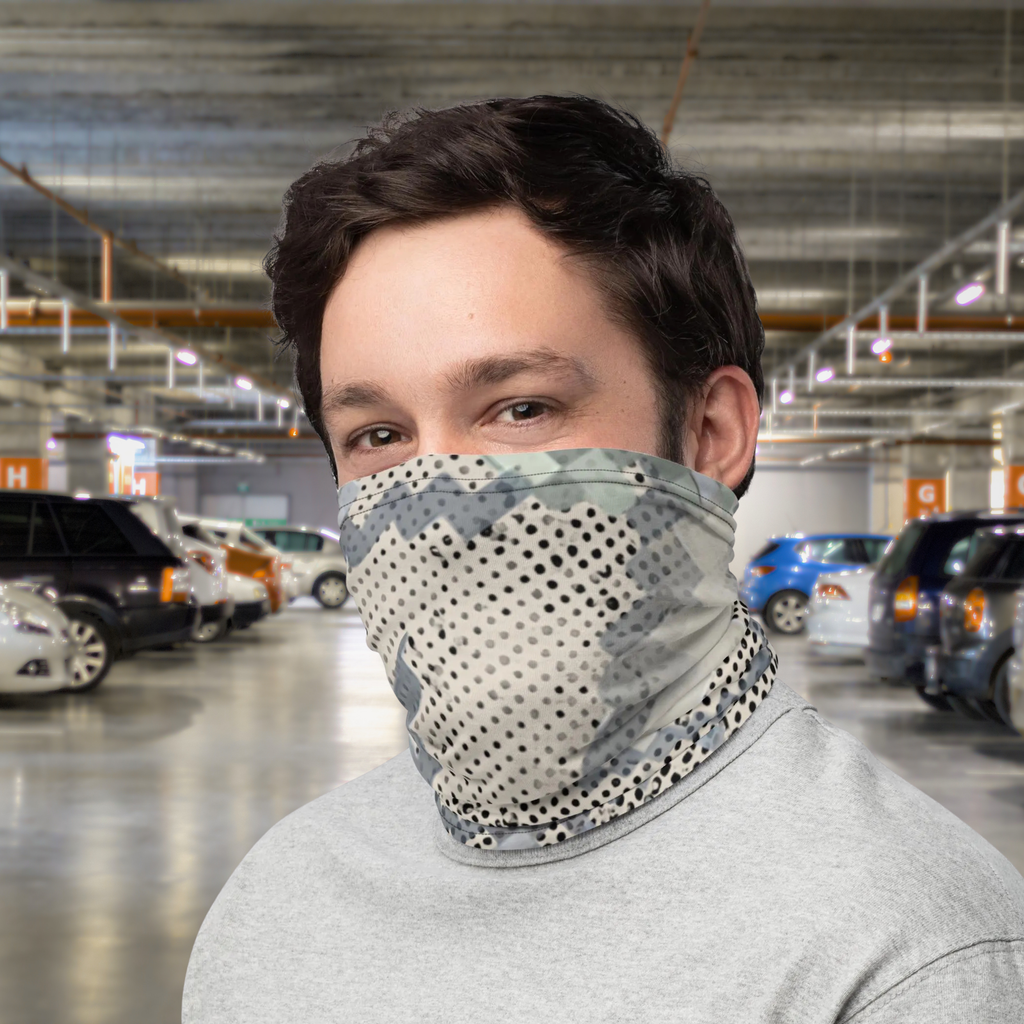 Urban Concrete 9 neck gaiter worn as a face covering in a car park, front view.