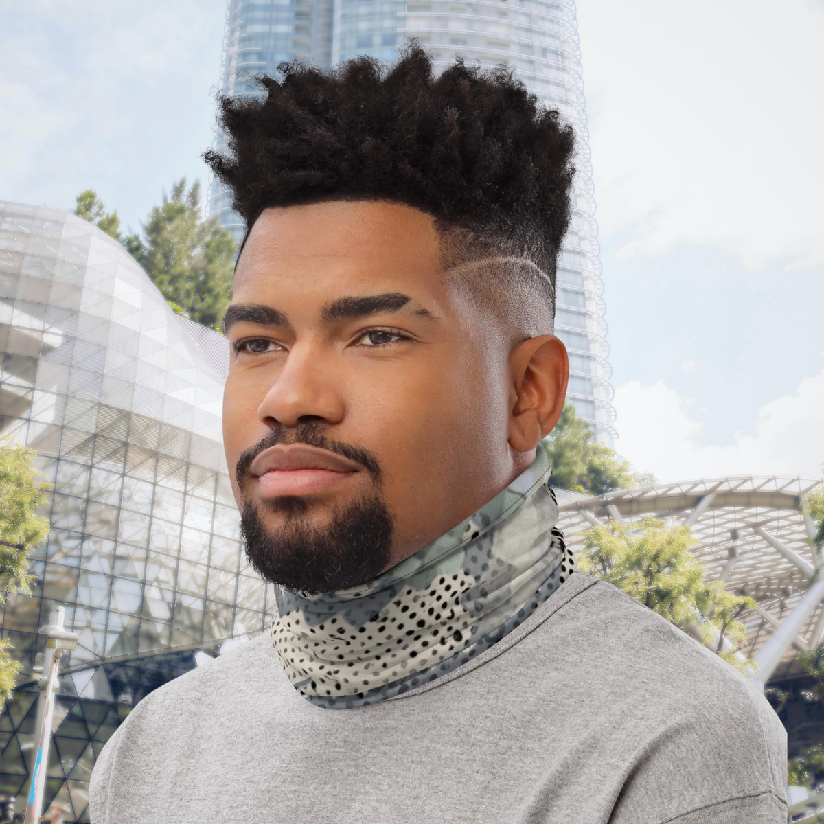 Urban Concrete 9 neck gaiter worn as a neck warmer outside a modern glass building.