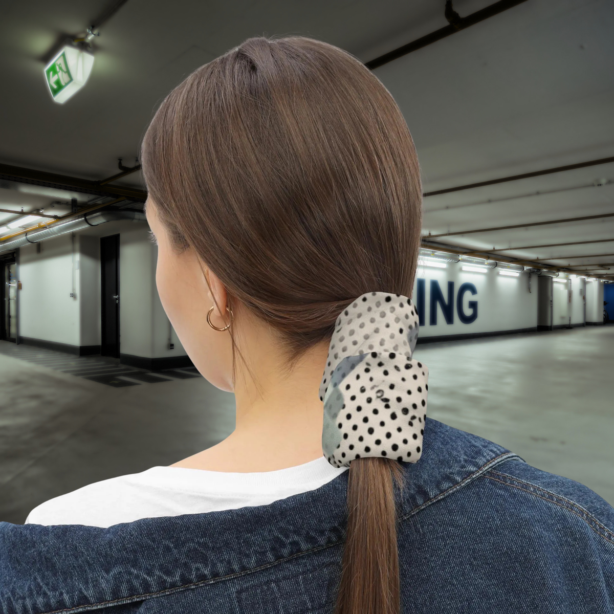 Urban Concrete 9 neck gaiter used as a ponytail wrap in a car park, rear view.