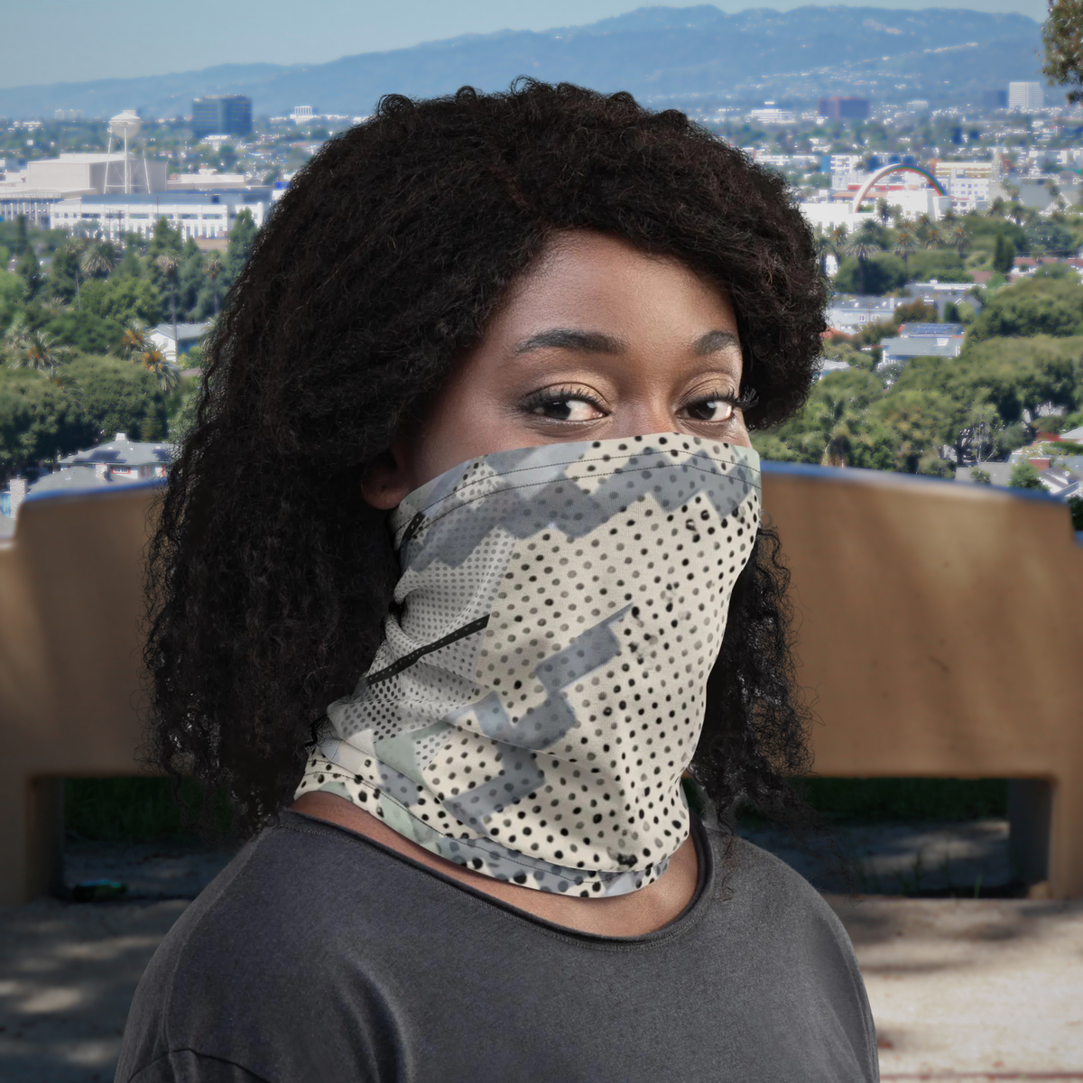Urban Concrete 9 neck gaiter worn over the nose and mouth with a dark T-shirt, front view.