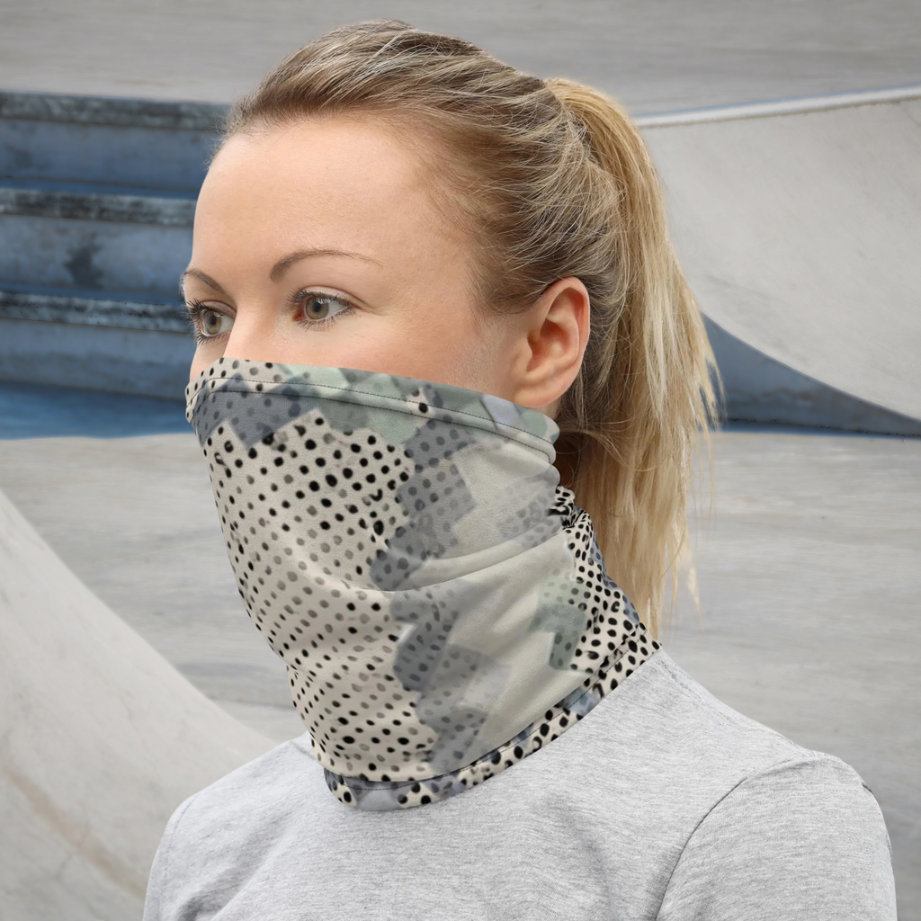 Urban Concrete 9 neck gaiter worn as a face covering outdoors with a grey top, three-quarter view.