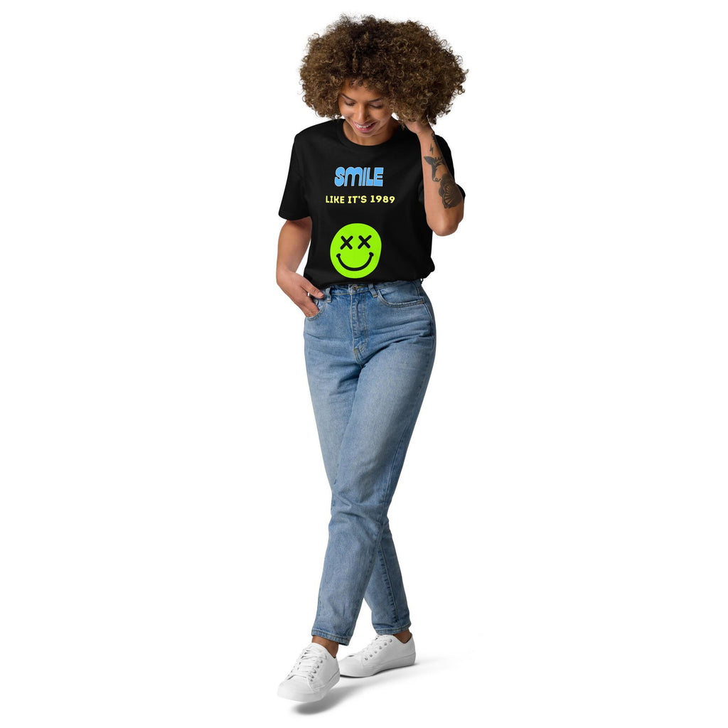 Smile Like It's 1989 rave T-shirt in black, full-length view on a model with blue jeans.