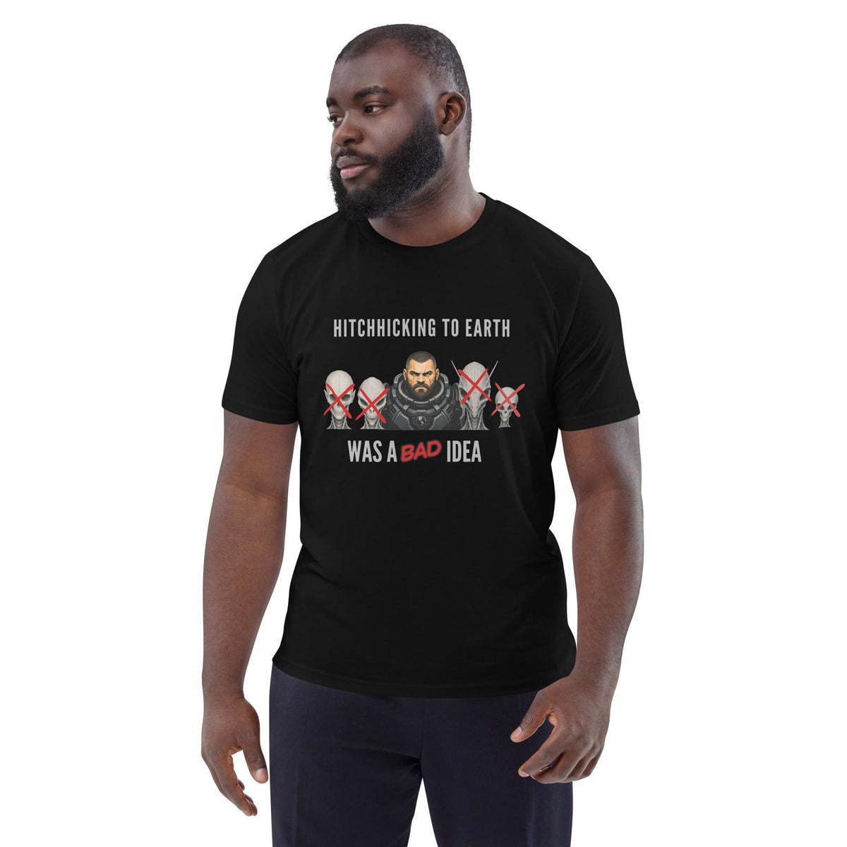 Alien Hitchhiking T-shirt in black, worn by a model with dark trousers, three-quarter view.