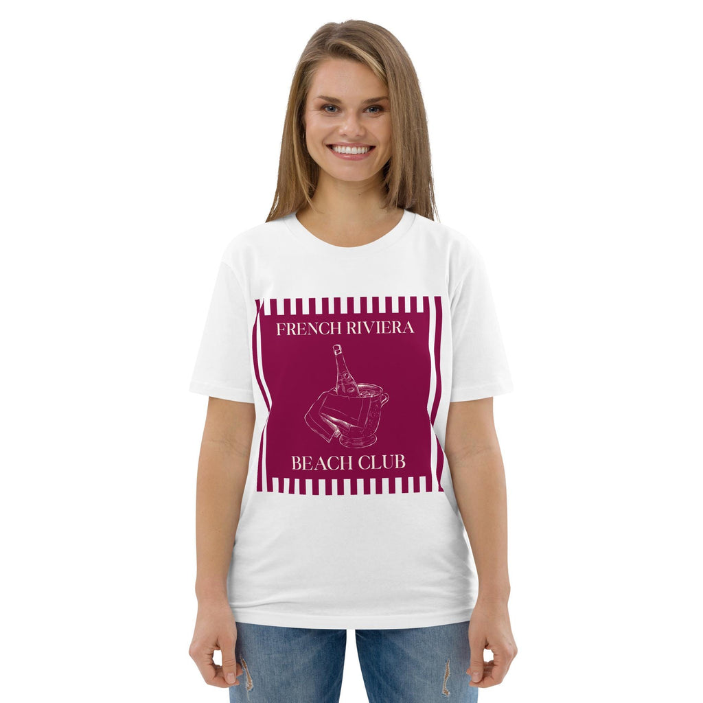 French Riviera Beach Club T-shirt in white, worn by a model with jeans, front view on white.