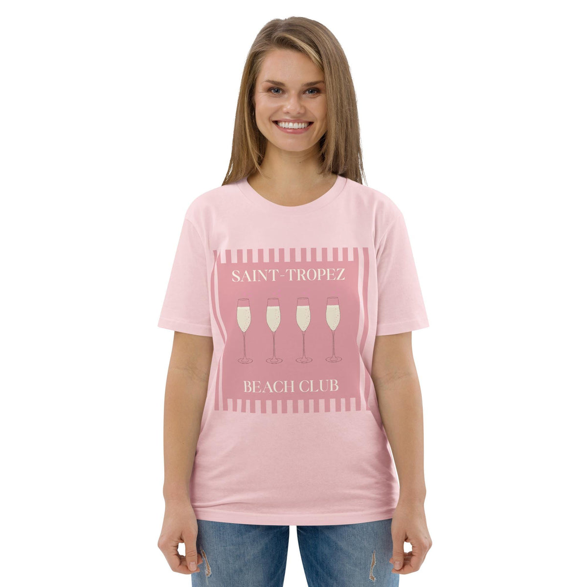Saint-Tropez Beach Club T-shirt in pink, worn by a model with blue jeans, front view.