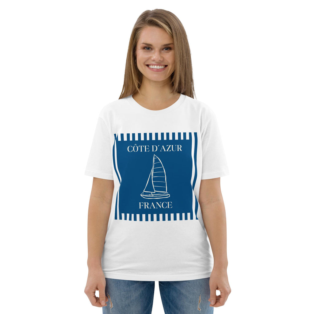 Côte d'Azur sailboat T-shirt in white, worn by a model with jeans, front view.