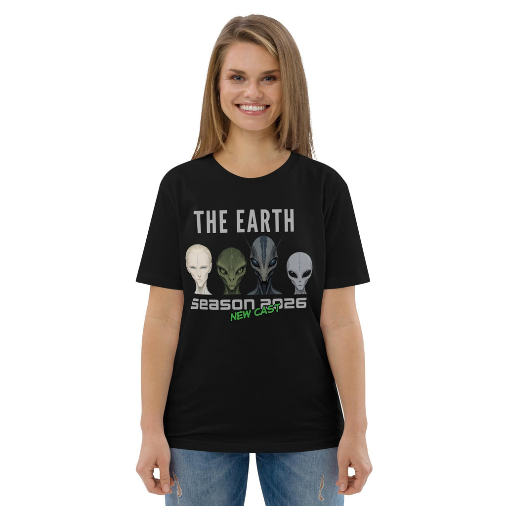 The Earth Season 2026 alien T-shirt in black, worn by a model with blue jeans, front view.