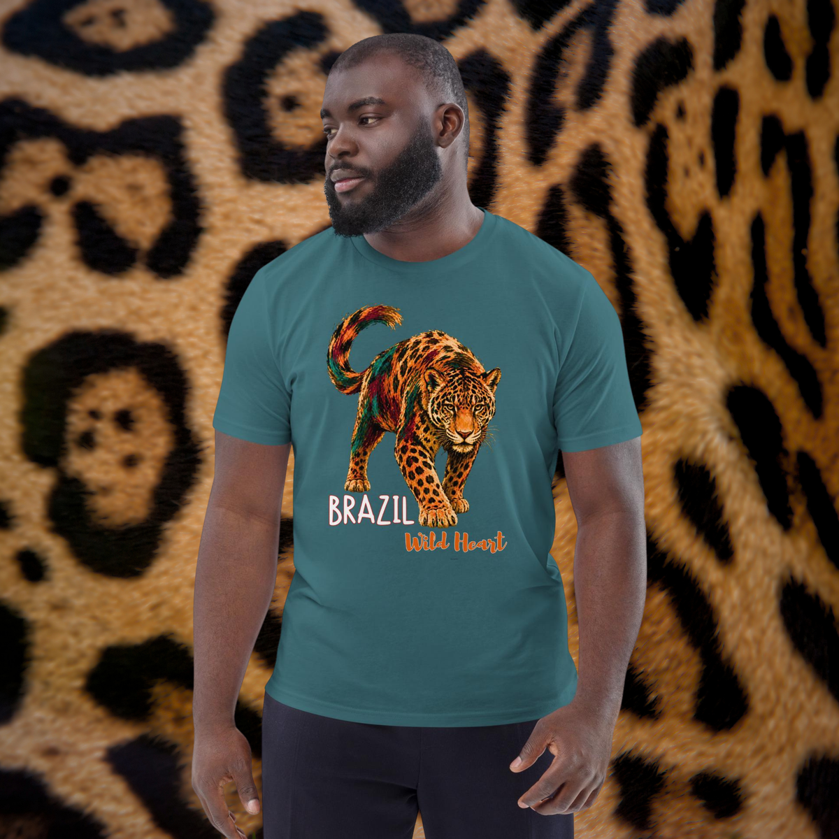 Brazil Jaguar T-shirt in teal, worn by a model against a spotted jaguar-pattern backdrop.