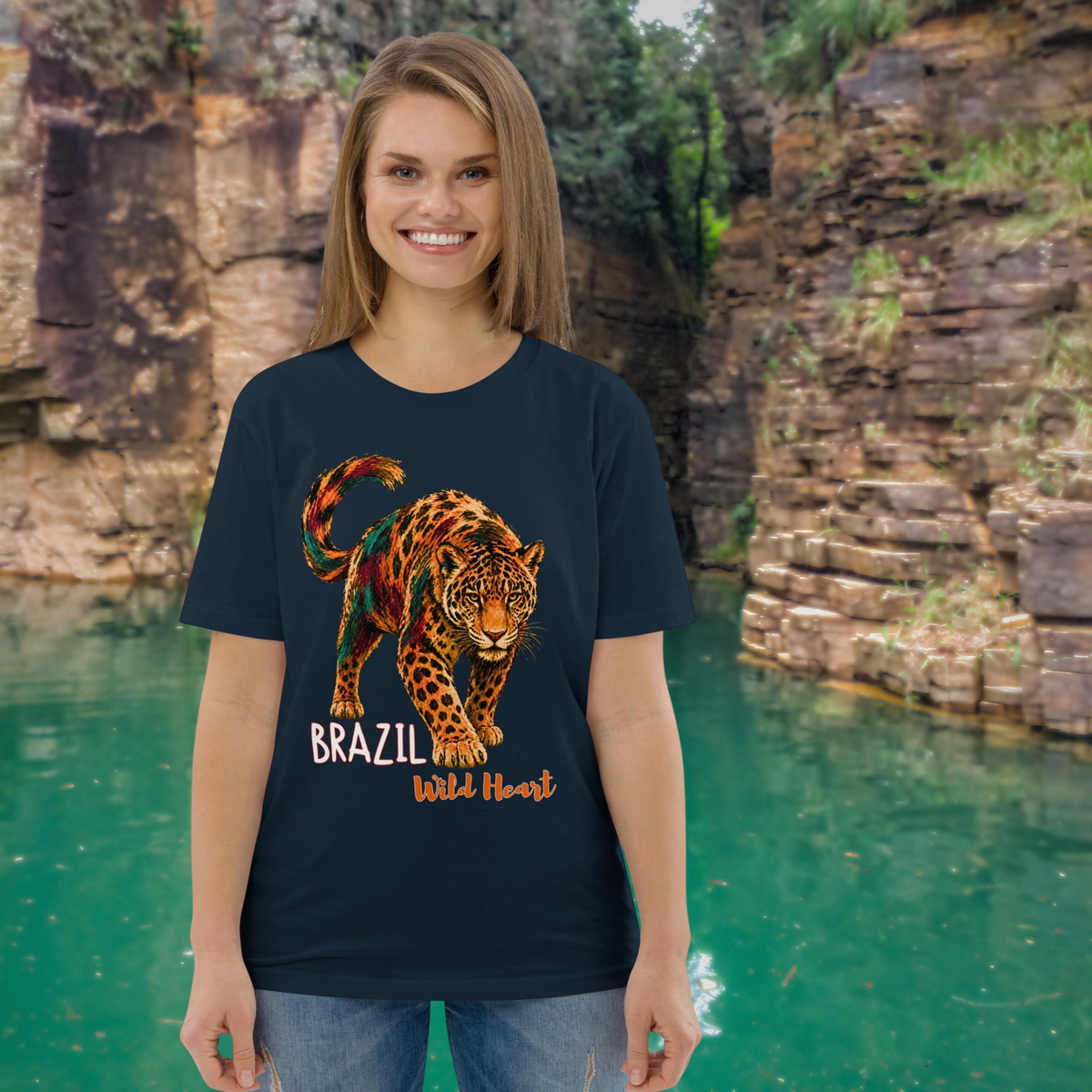 Brazil Jaguar T-shirt in navy, worn by a model beside a rocky green pool.