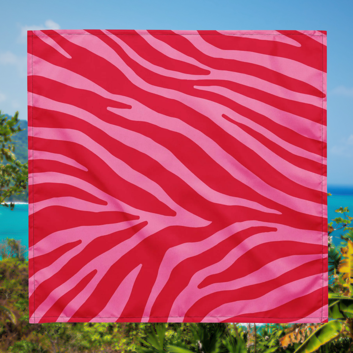 Pink Zebra bandana laid flat to show the pink and red zebra pattern.