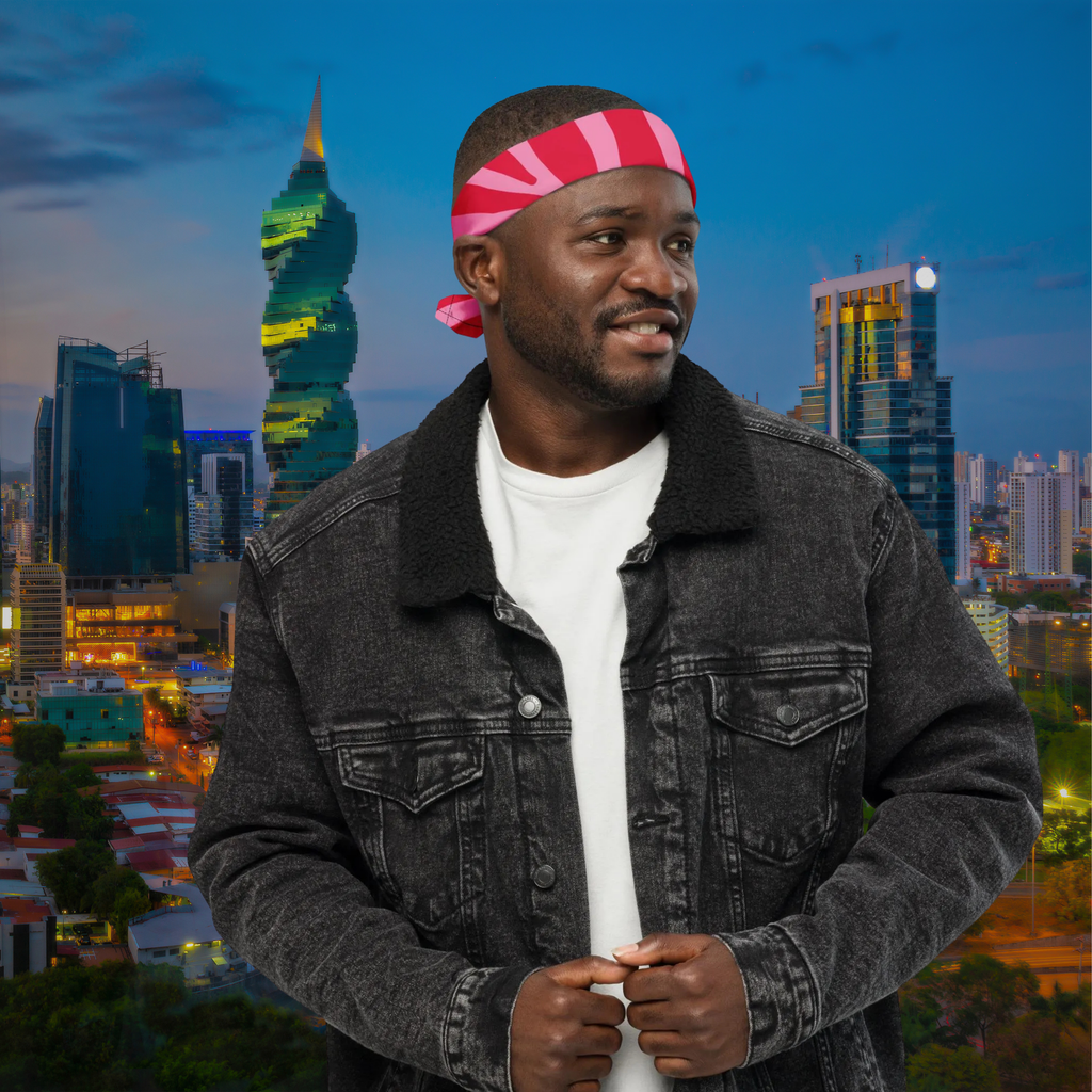 Pink Zebra bandana worn as a headband with a dark denim jacket, three-quarter view.