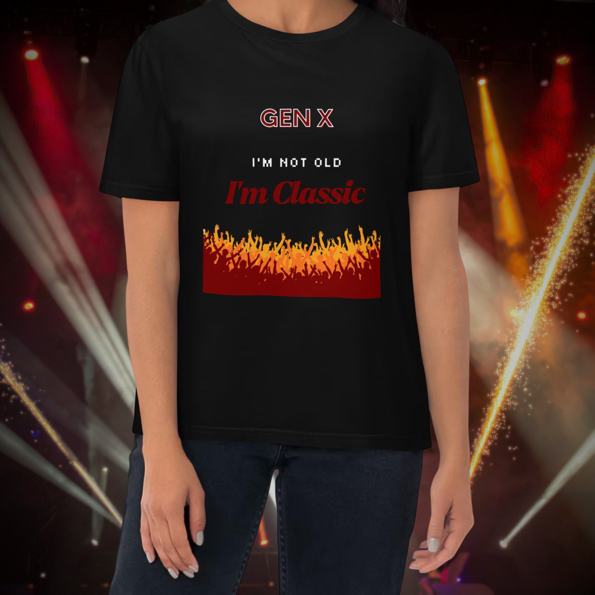 Gen X Orange Flame Classic T-shirt in black, torso view against warm stage lights.