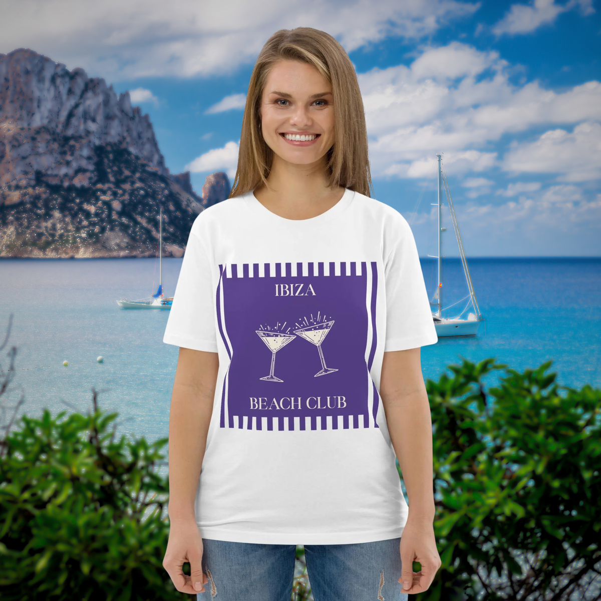 Ibiza Beach Club T-shirt in white, worn by a model against a turquoise coastal backdrop.