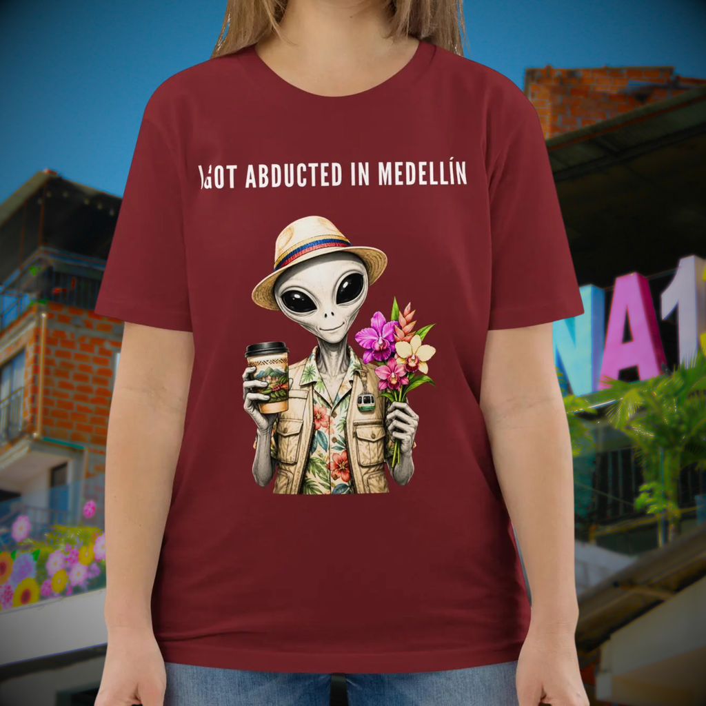 I Got Abducted in Medellin alien T-shirt in burgundy, torso view showing the alien and flowers.