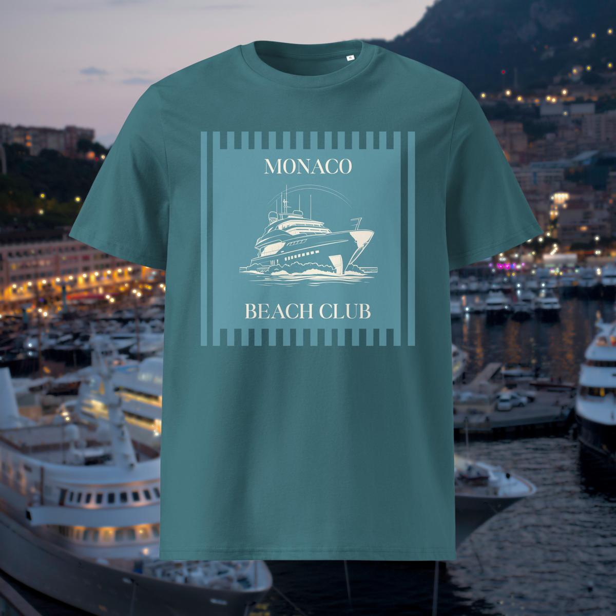 Monaco Beach Club T-shirt in teal, front product view against a harbour at dusk.