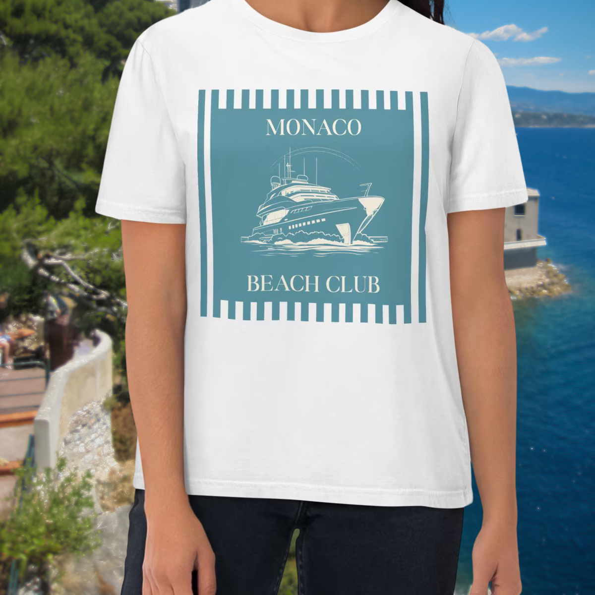 Monaco Beach Club T-shirt in white, torso view showing the blue-green beach club artwork.