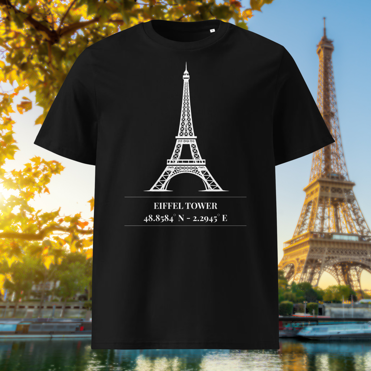 Black Paris T-shirt with a white Eiffel Tower line drawing and coordinates, shown in an autumn city setting.