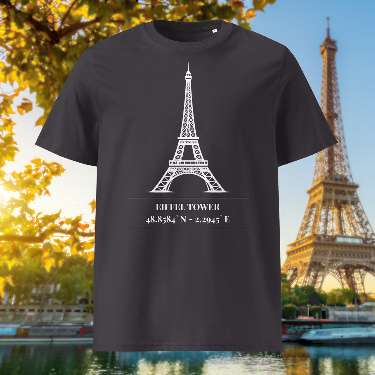 Anthracite Paris T-shirt showing the white Eiffel Tower line drawing and coordinates in an autumn city setting.