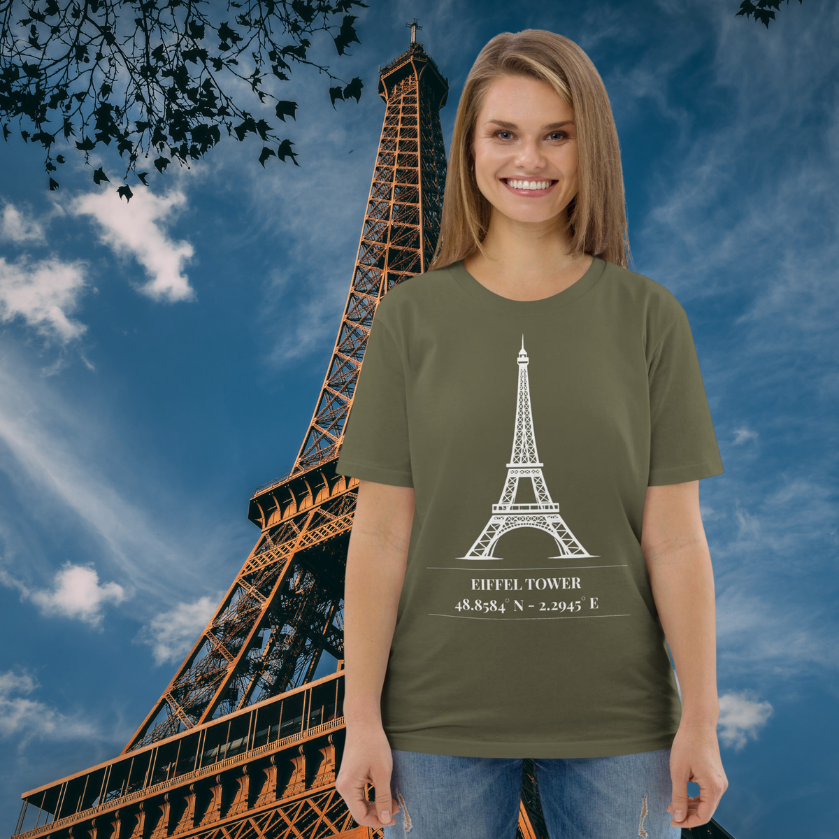 Woman wearing the khaki Eiffel Tower coordinates T-shirt in front of the Paris landmark.