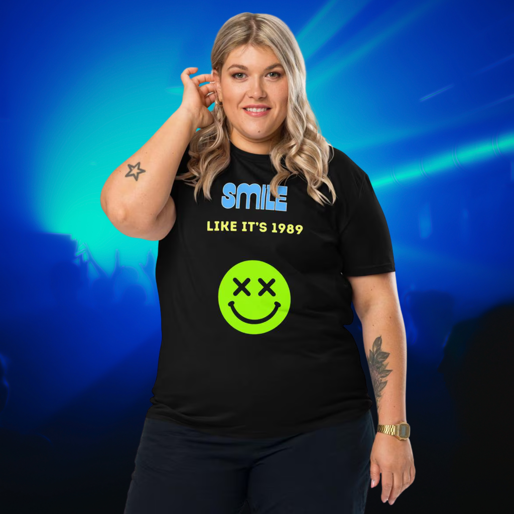 Smile Like It's 1989 rave T-shirt in black, worn by a model against blue and green nightclub lights.