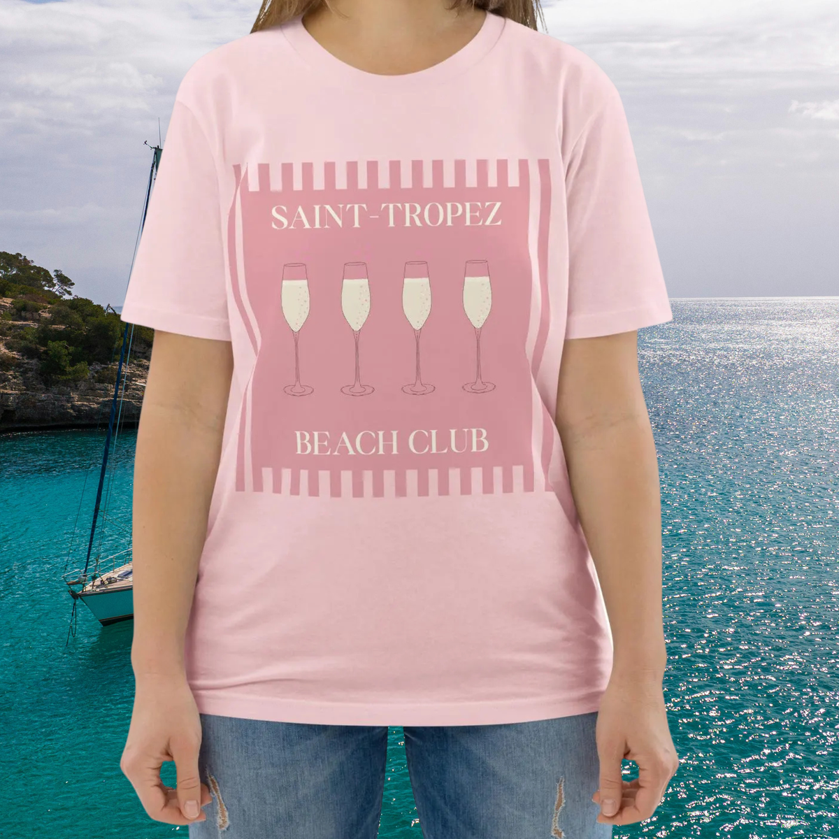 Saint-Tropez Beach Club T-shirt in pink, torso view showing the pale pink beach club graphic.