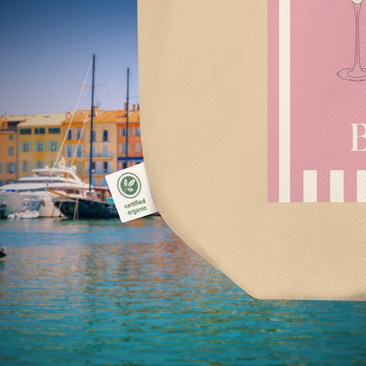 Close-up of the Saint-Tropez tote's cotton fabric, pink print and organic cotton label.