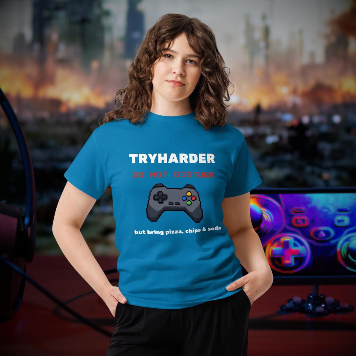 Tryharder gamer T-shirt in sapphire blue, worn by a model beside a gaming setup.
