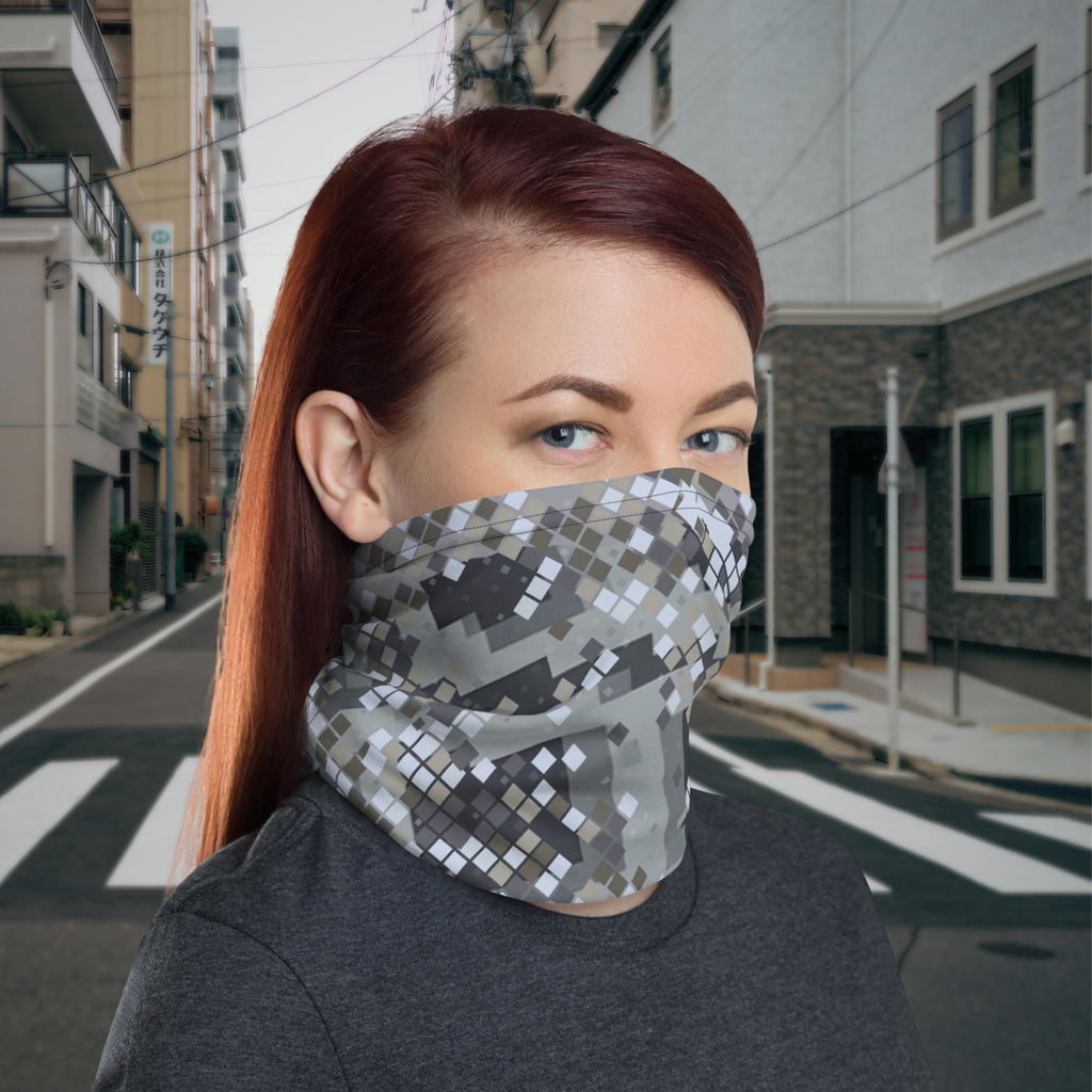 Urban Concrete 2 neck gaiter worn as a face covering on a city street, three-quarter view.