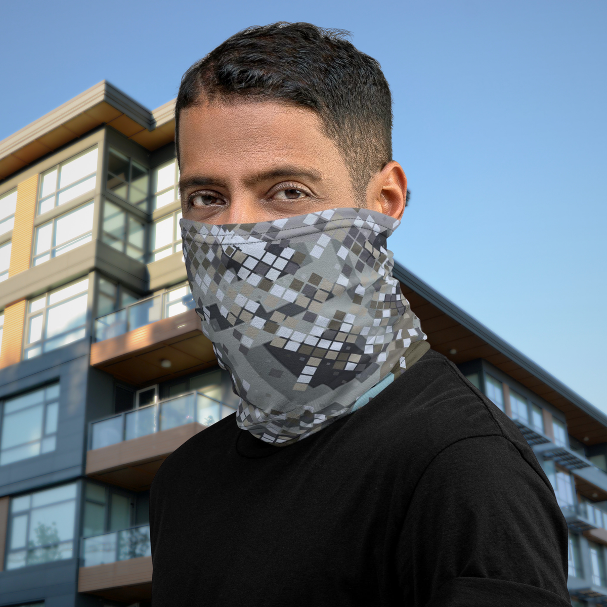 Urban Concrete 2 neck gaiter worn as a face covering outside a modern building.