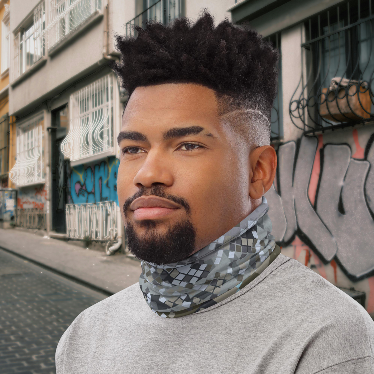 Urban Concrete 2 neck gaiter worn as a neck warmer beside apartment buildings.
