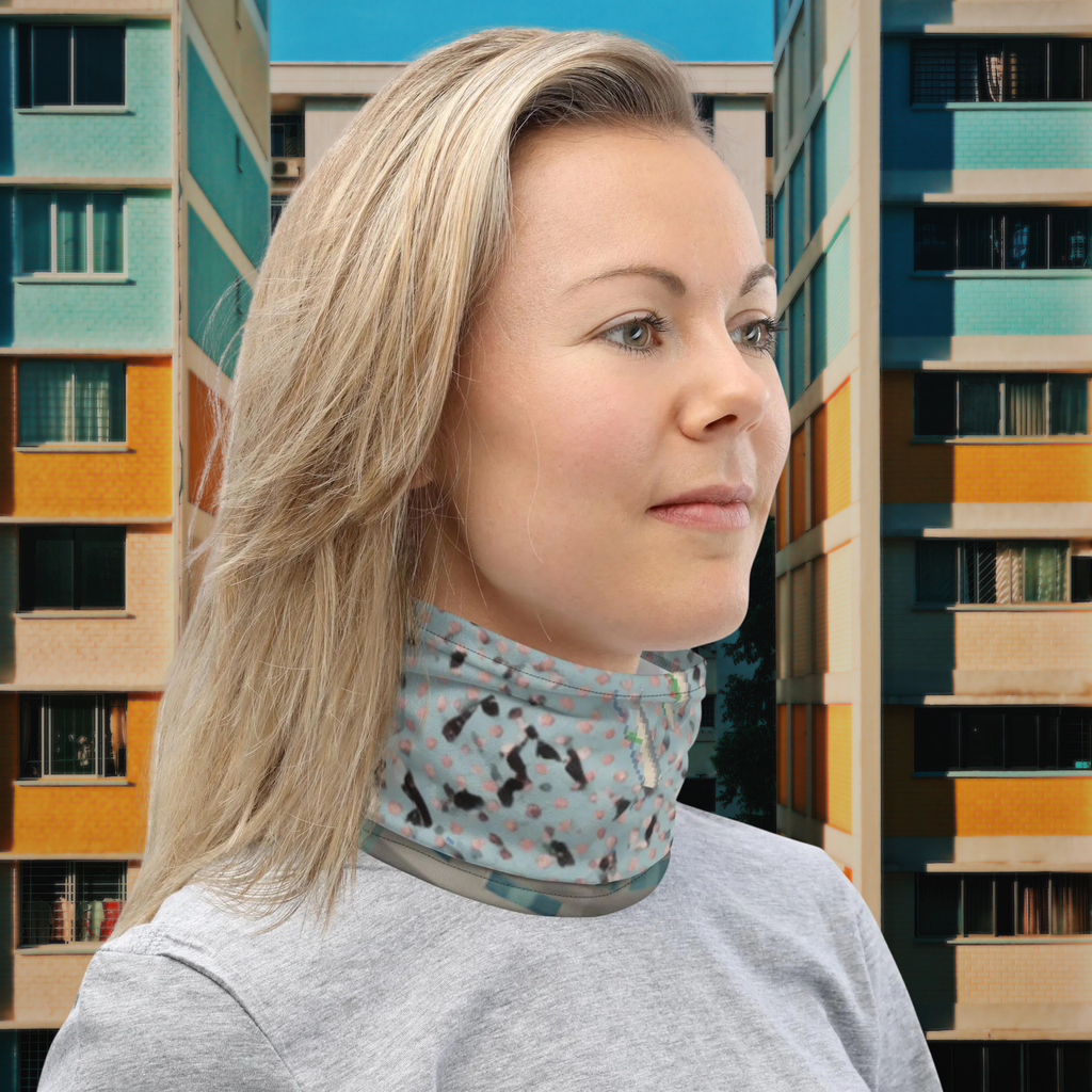 Urban Concrete 3 neck gaiter worn as a neck warmer outside an apartment building.
