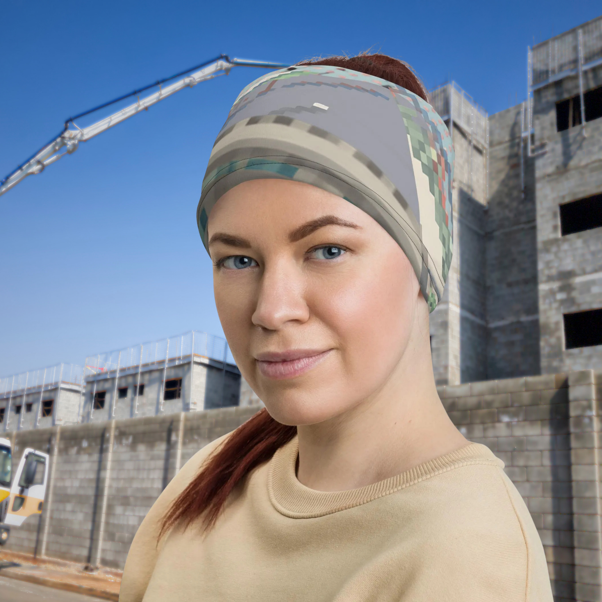 Urban Concrete 3 neck gaiter worn as a headband beside modern buildings.