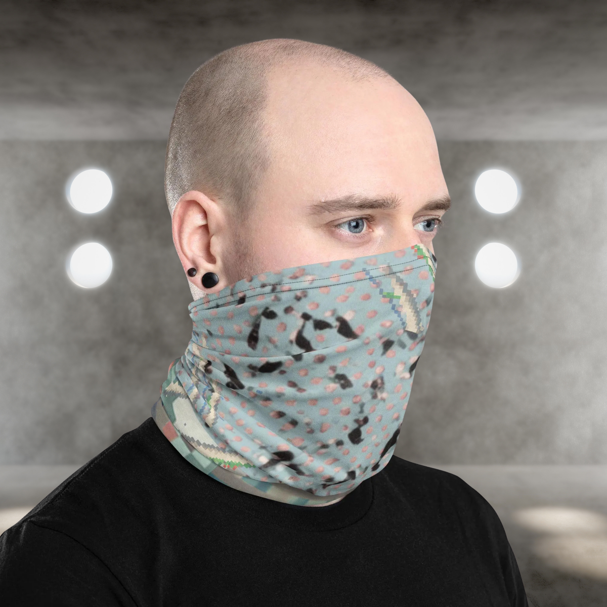 Urban Concrete 3 neck gaiter worn as a face covering in a concrete building, three-quarter view.