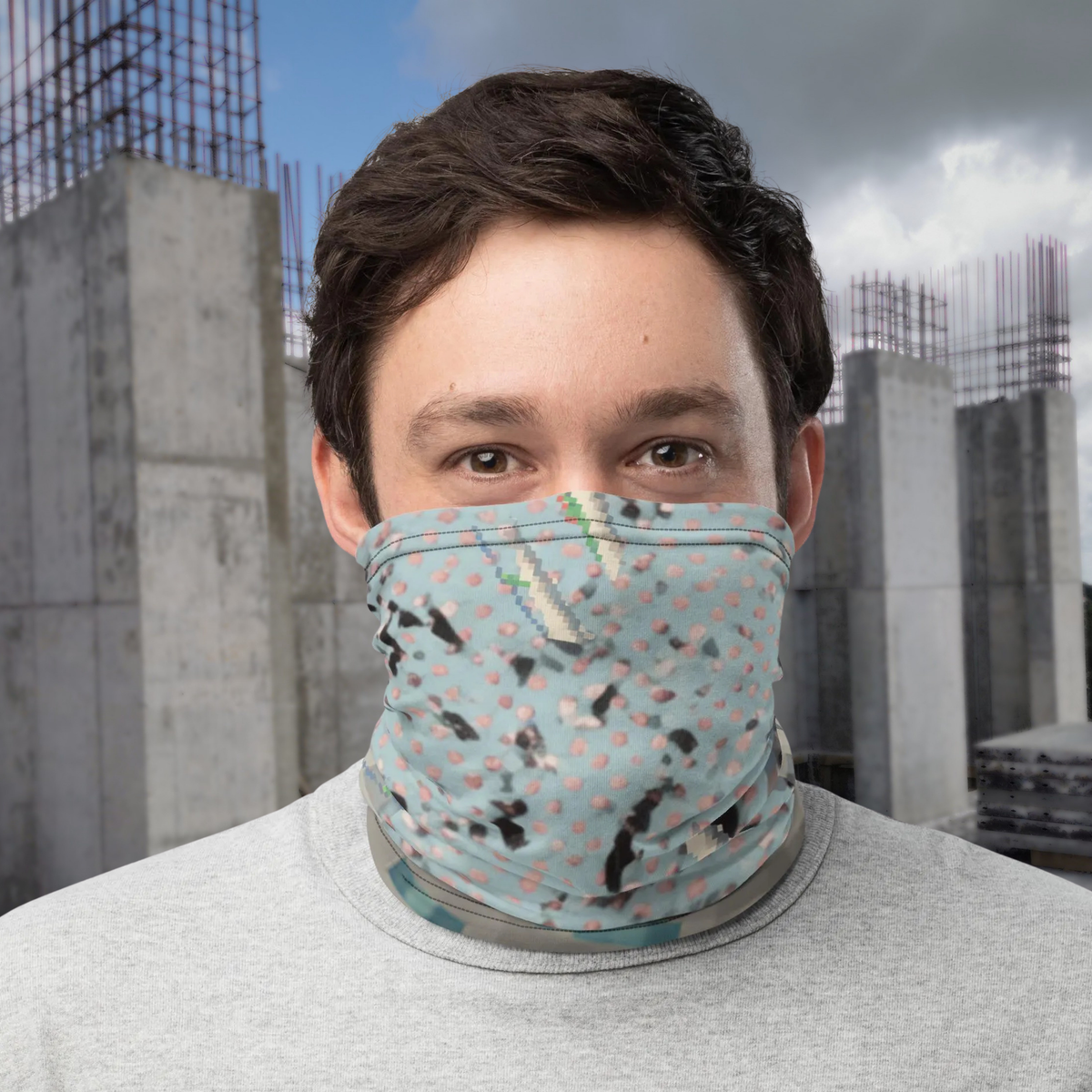 Urban Concrete 3 neck gaiter worn as a face covering outside modern buildings, front view.
