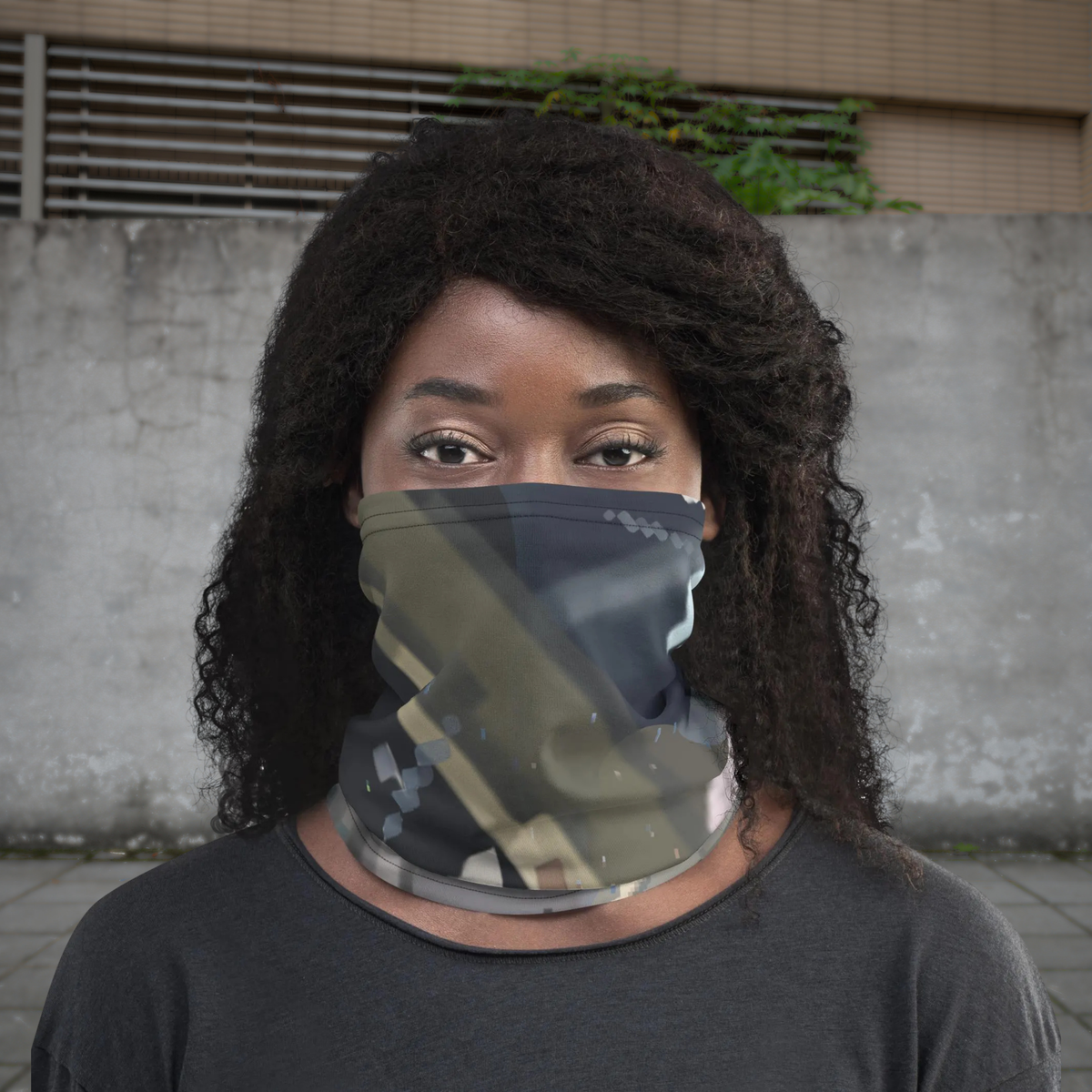 Urban Concrete 4 neck gaiter worn as a face covering against a concrete wall, front view.
