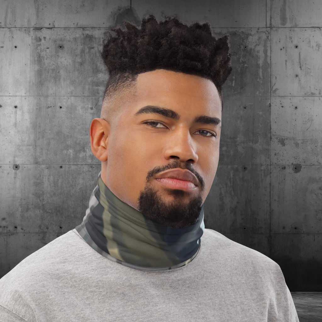Urban Concrete 4 neck gaiter worn as a neck warmer against a concrete wall.