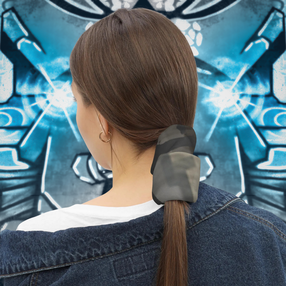 Urban Concrete 5 neck gaiter used as a ponytail wrap against a graffiti wall, rear view.