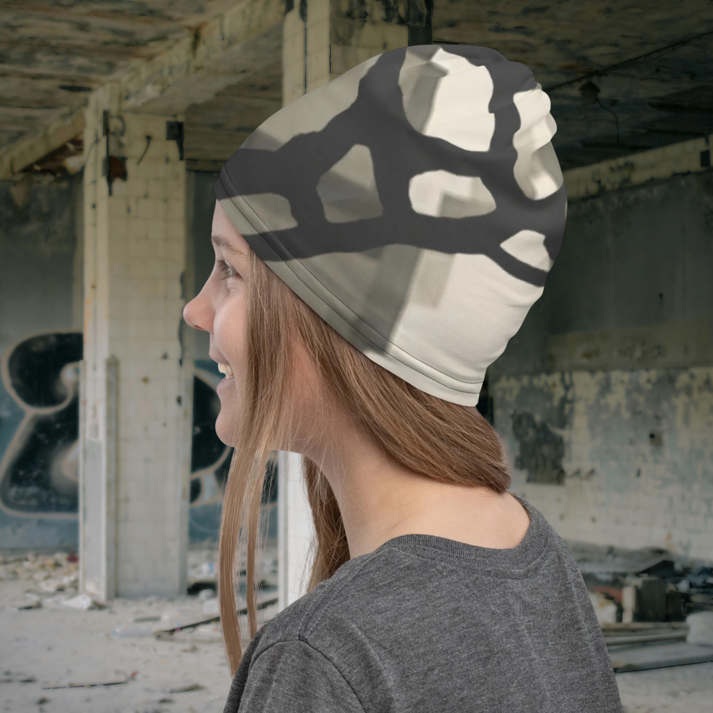 Urban Concrete 5 neck gaiter worn as a beanie in a graffiti-covered building, rear side view.