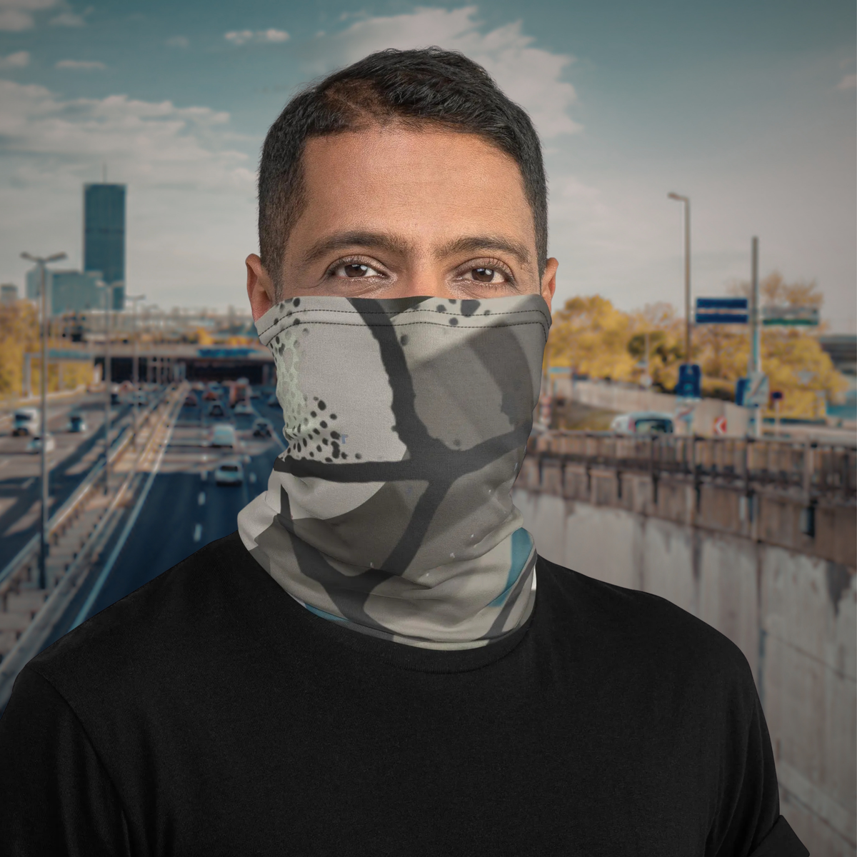 Urban Concrete 5 neck gaiter worn over the nose and mouth on an urban walkway.