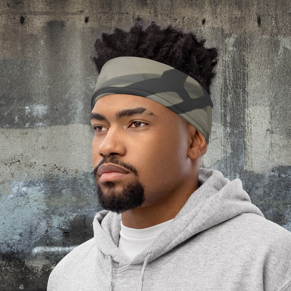 Urban Concrete 5 neck gaiter worn as a headband with a grey hoodie.