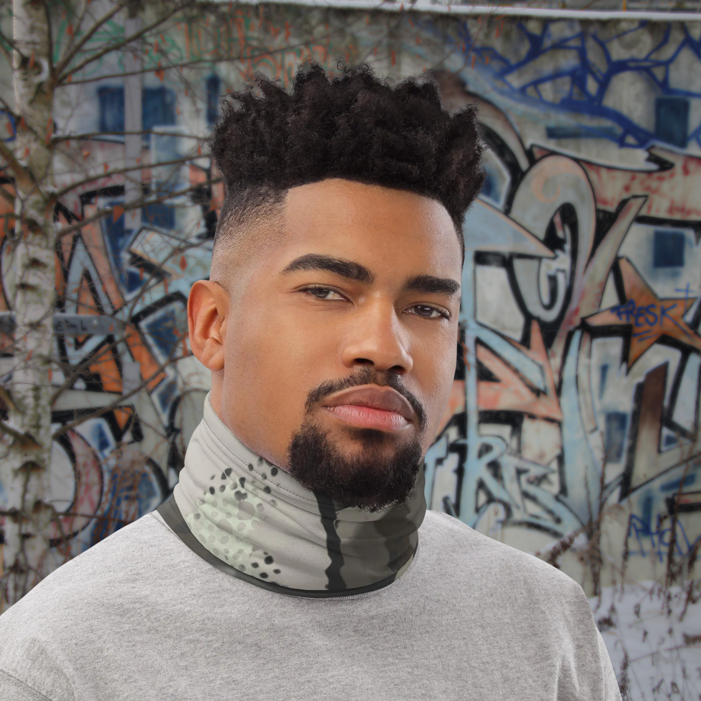 Urban Concrete 5 neck gaiter worn as a neck warmer beside a graffiti-covered wall.