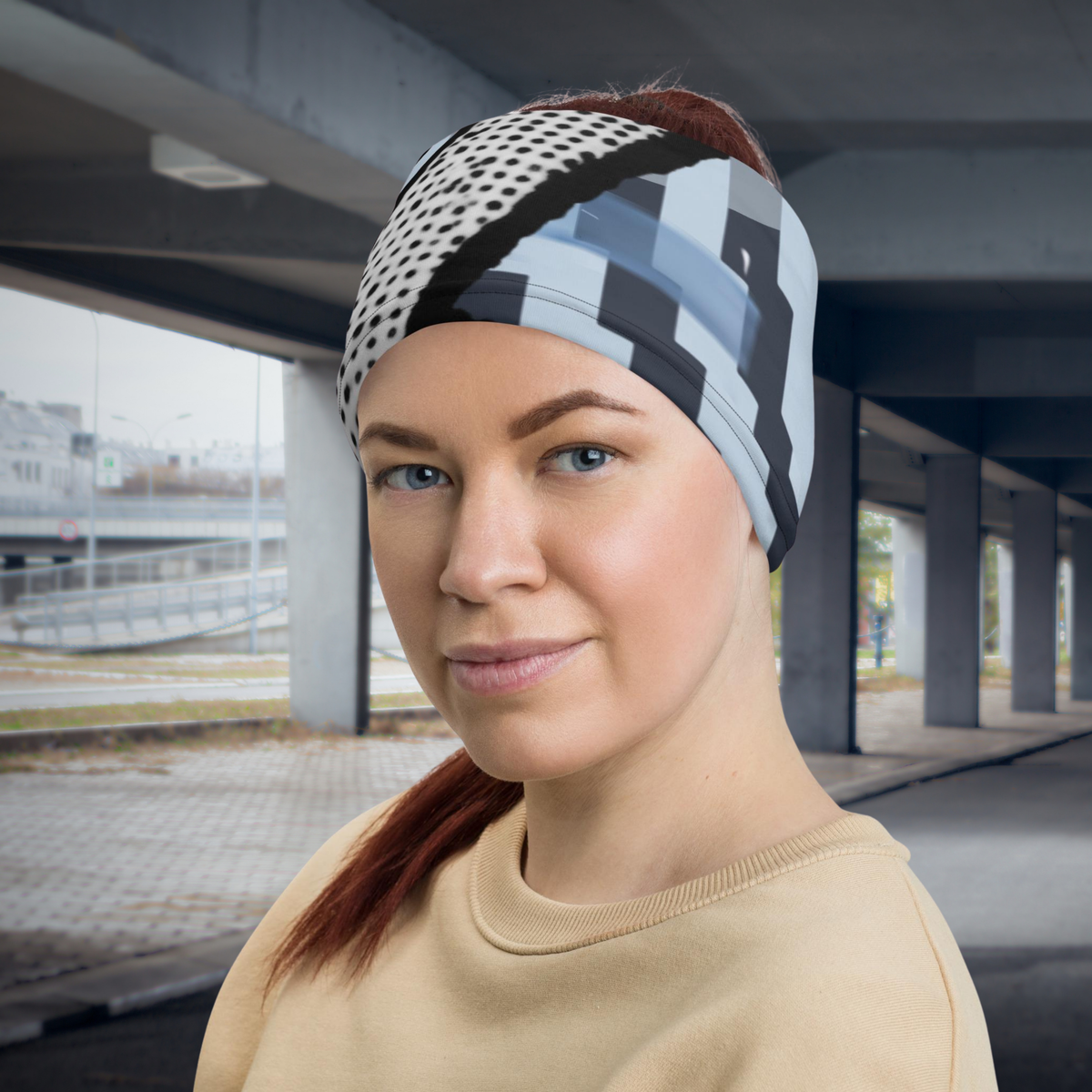 Urban Concrete 6 neck gaiter worn as a headband beneath a concrete overpass.
